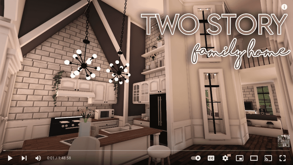 Shows an inside look at a bloxburg 2 story house kitchen and living room area from a video done by nxght_skiies on youtube.
