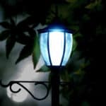 Shows a night photo of the single head solar lamp post with plant hangers - techgoodandbad.com